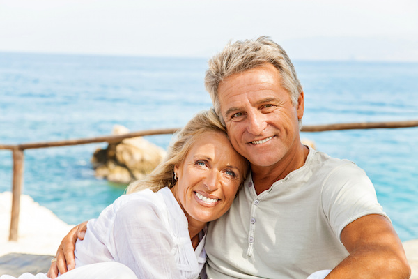Happy older couple on water