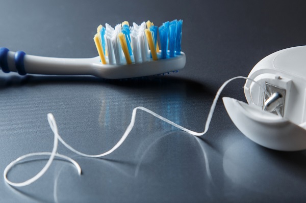 toothbrush and dental floss